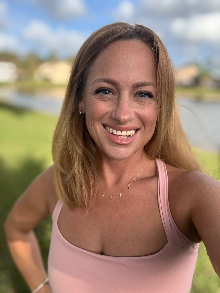 Jen Mazer, artist and party designer, smiling outdoors